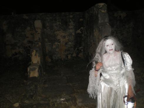 Our Ghostly Host explaining how the mortuary was next to the kitchen in the Hospital.